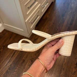 Dolce Vita sandal w/ heel in a cream embossed crocodile finish. Looks great on!